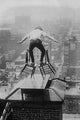 Reynolds Balancing Act on Roof Poster Print capturing urban life in New York City.
