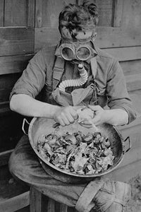 Soldier wearing gas mask to avoid crying over onions poster print