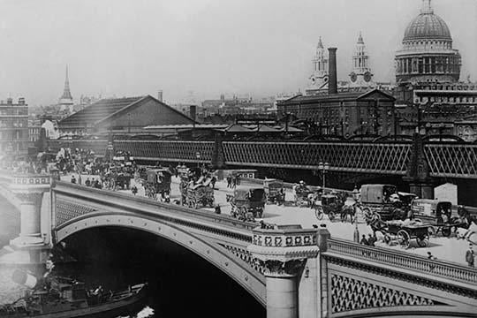 Procession of Horse Drawn Vehicles crossing Black Friar's Bridge poster print with Thames and St. Paul's Cathedral.
