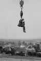 Still Photographer Hanging from Crane Poster Print