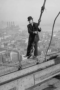 Cameraman in suit walking on skyscraper steel girders poster print.