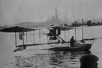 Biplane landing in the canals of Venice poster print