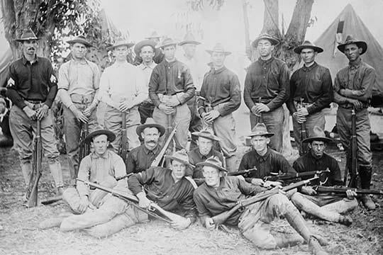 Group of men holding rifles in both military and civilian clothing poster print.