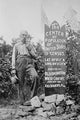 The Center of Population of U.S. poster print featuring a man standing next to a memorial stone.