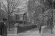 Poster print of a man walking down a tree-lined street in Germantown.
