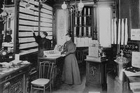 Interior of Retail Clothier in Berlin, Germany Poster Print featuring a woman being attended to.
