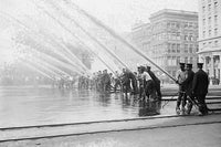 Fireman testing high-pressure hoses in New York poster print.