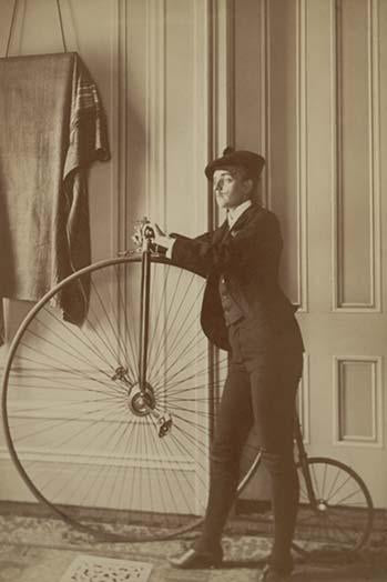 Frances Benjamin Johnston full-length self-portrait poster print featuring a woman dressed as a man with a penny farthing bicycle.
