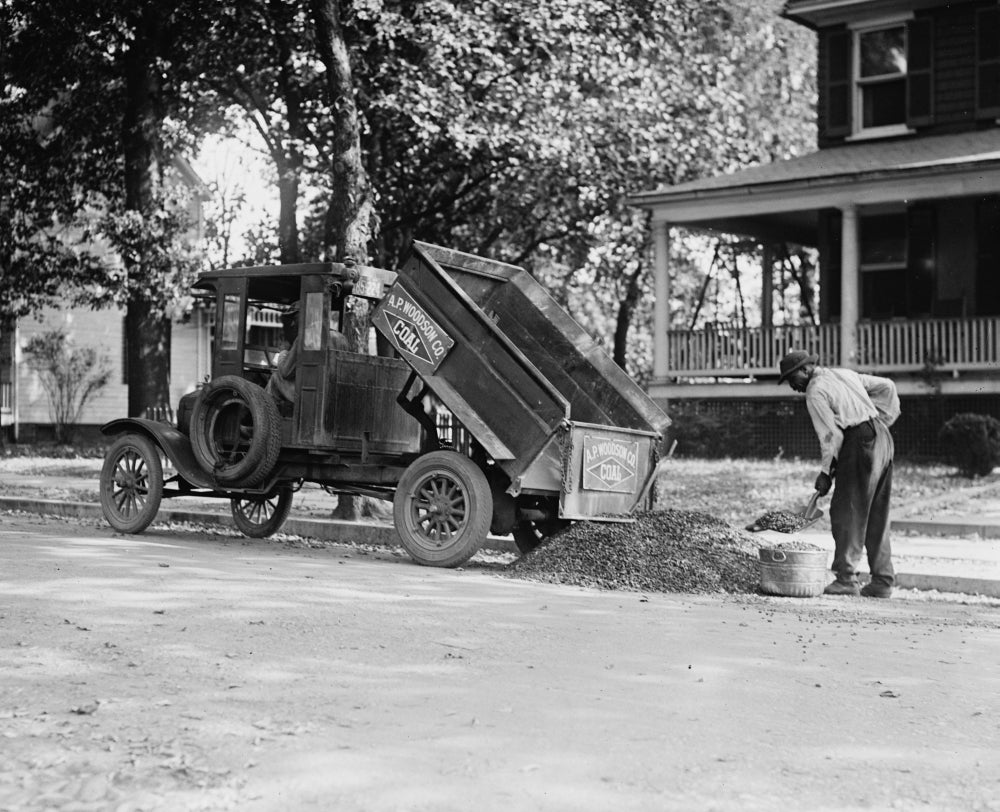 Heating Coal Poster Print featuring an African American worker shoveling coal.