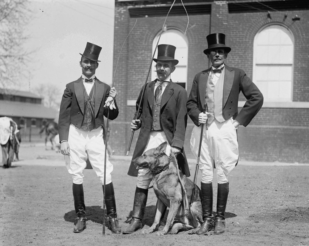 Circus Ringmasters with German Shepherd Poster Print featuring top hats and lion tamer whips.