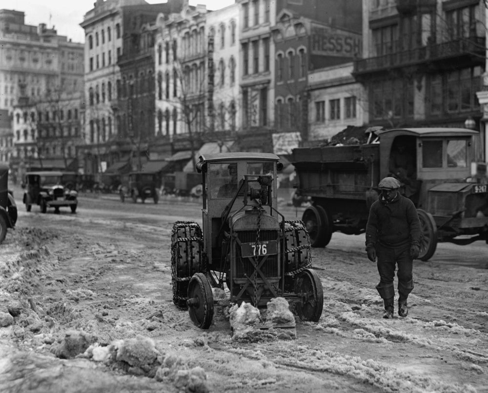 Ford tractor removing snow from sidewalks poster print