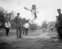 Grade School Girl taking an Olympic long jump poster print.