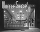 Congressional Break Art Deco Waffle Shop Poster Print featuring a deserted restaurant exterior and neon lights.