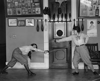 Dynamic Women's Fencing in Gym Poster Print showcasing action and skill.