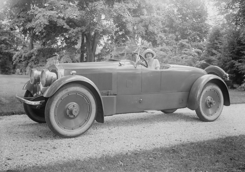 Woman Driver in Fancy Rolls Royce Poster Print showcasing luxury and elegance.