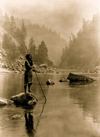 Hupa Man with Spear Poster Print featuring a man on a rock with foggy mountains in the background.