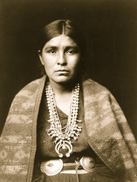 Head-and-shoulders portrait of a Navajo woman, showcasing Indigenous beauty and culture.