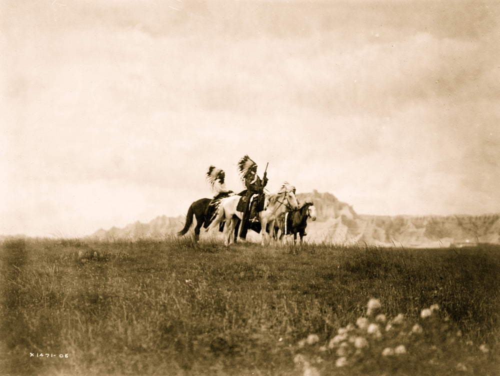 Art print of Three Sioux Indians on horseback in the plains.