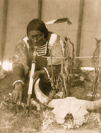 Dakota man with calumet kneeling by altar inside tipi poster print.