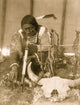 Dakota man with calumet kneeling by altar inside tipi poster print.