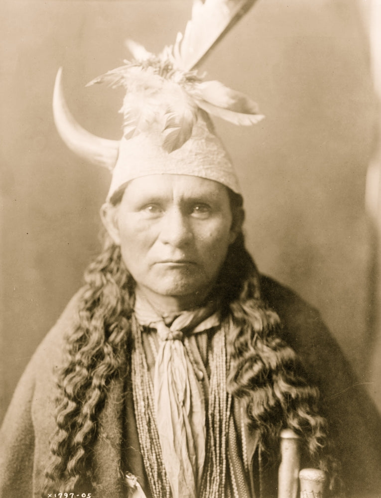Oyegi-a ye ('Frost Moving') head-and-shoulders portrait poster print with feathers and horn.