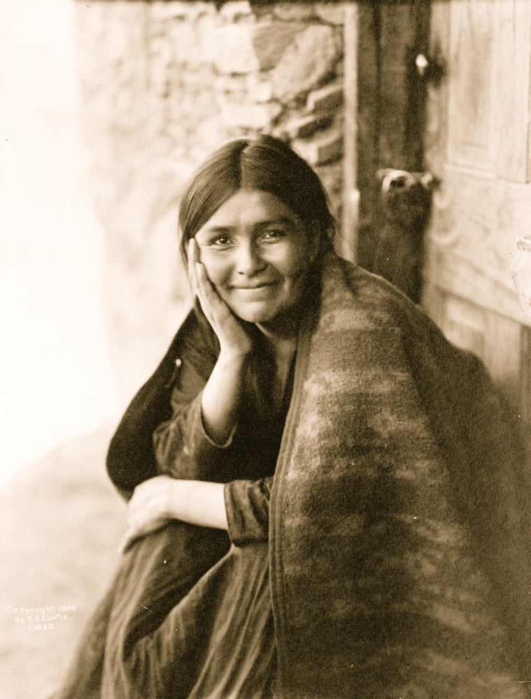 Navaho woman smiling outside her doorway poster print.