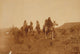 Five Native Americans on horseback in desert landscape poster print.