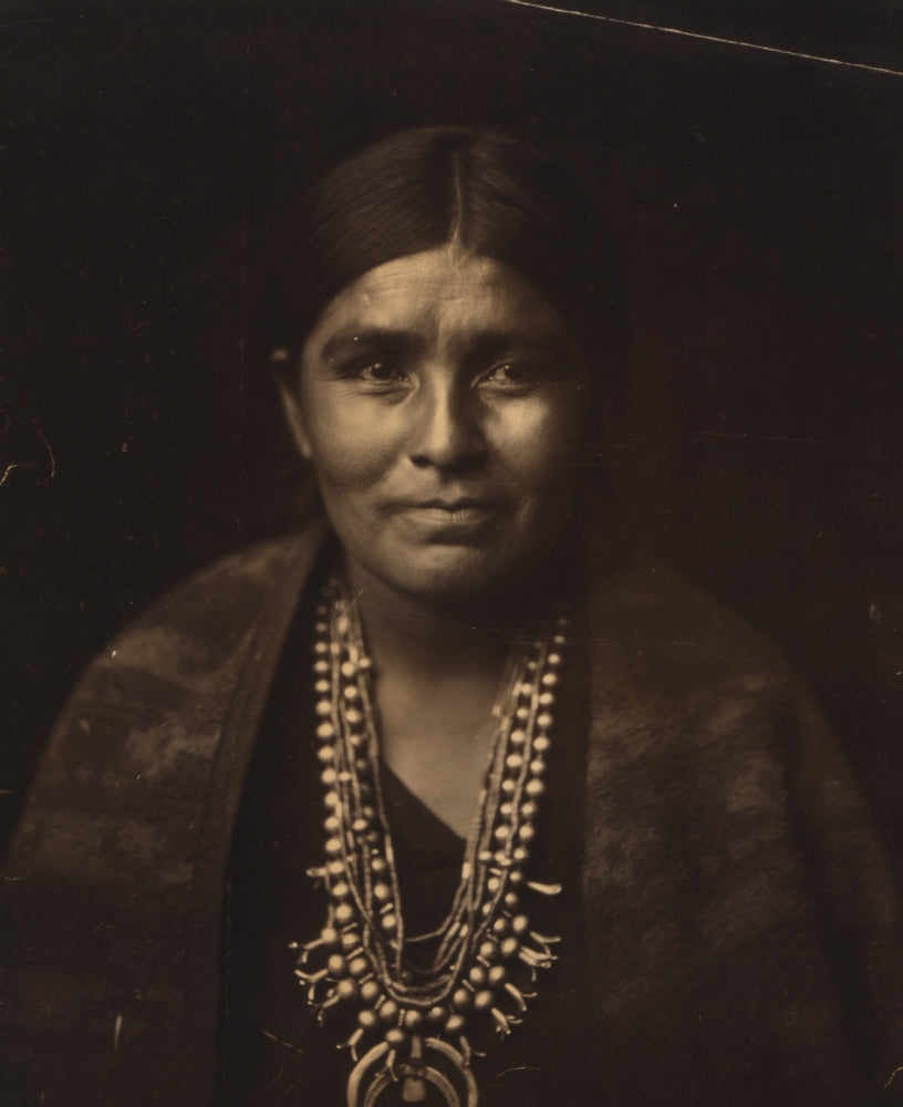 Head-and-shoulders portrait of a Navajo woman, vibrant colors, cultural art