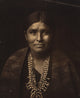 Head-and-shoulders portrait of a Navajo woman, vibrant colors, cultural art