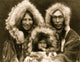 Three Eskimos Posed Poster Print showcasing a cultural scene.