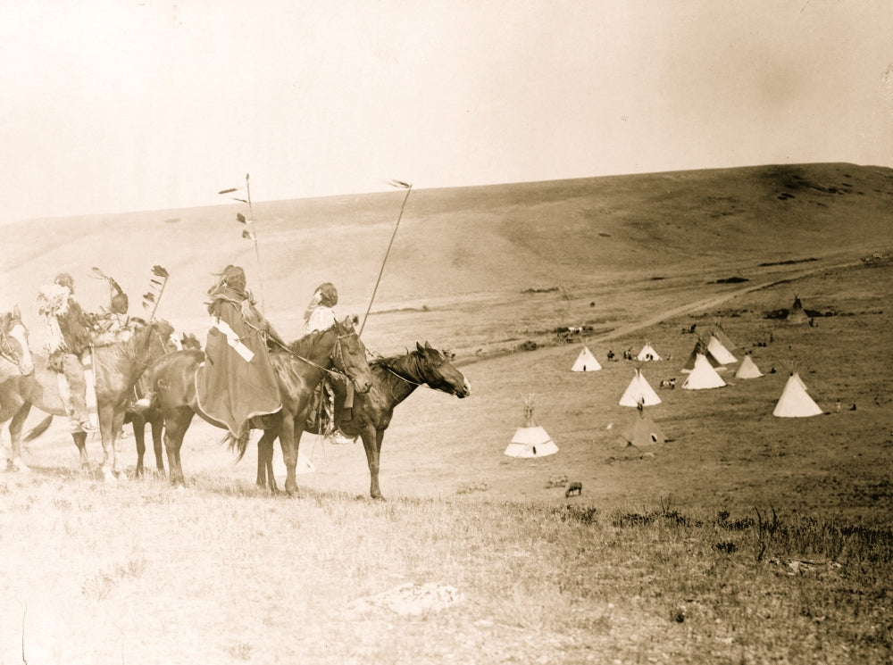 Four Atsina Indians on horseback overlooking tepees in a valley poster print.