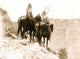 Packs The Hat and Which Way poster print featuring Crow Indians on horseback.