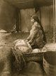 Half-length portrait of a Skokomish Indian chief's daughter seated in a canoe.