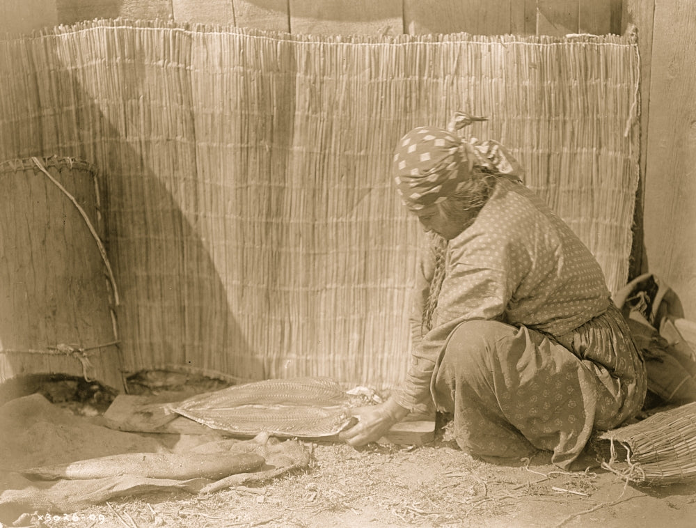 Poster of Tlakluit Indian woman placing salmon fillets on a wood plank