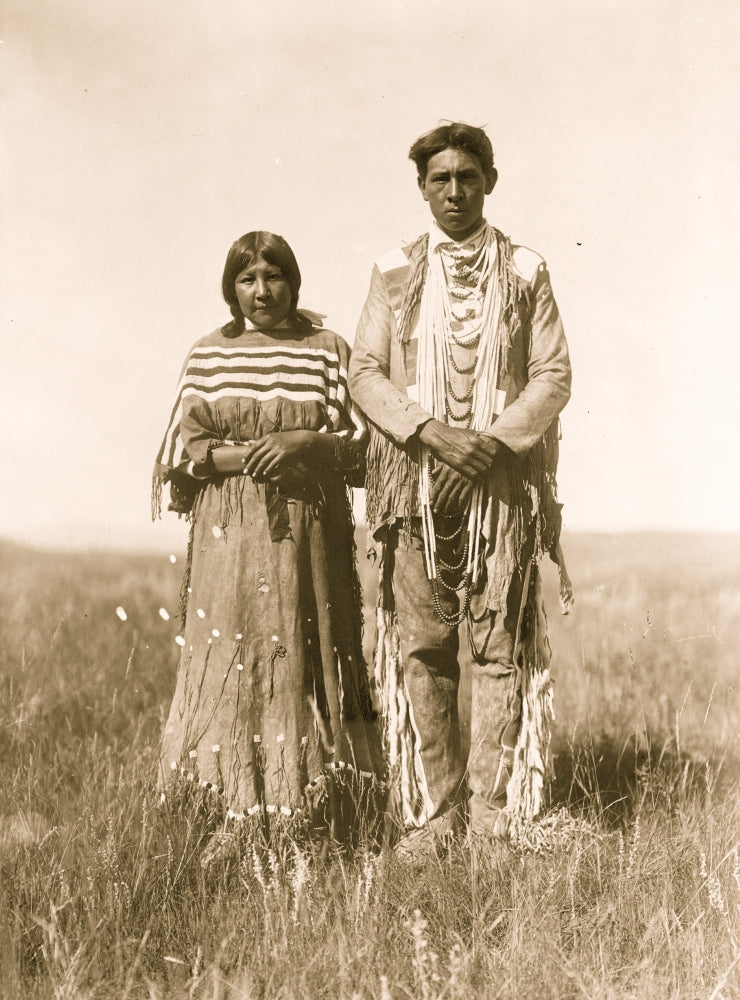 Piegan man and woman standing in open prairie poster print