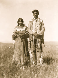 Piegan man and woman standing in open prairie poster print