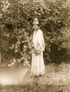 Nespelim Woman at Water's Edge Poster Print featuring serene nature scene.
