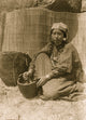 Tlakluit woman seated with mortar and pestle art poster print.