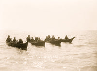 Four canoes on a large body of water poster print.