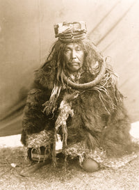 Kwakiutl man kneeling in traditional attire poster print