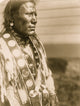Piegan Man Half-Length Portrait Poster Print showcasing Indigenous artistry.