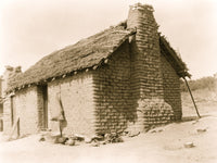Mud Brick & Thatch Home Poster Print showcasing rustic architecture.