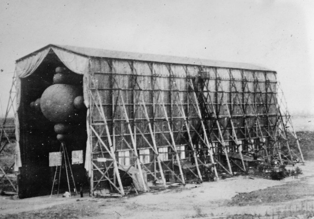 La Ville de Paris Dirigible Balloon Poster Print in hangar