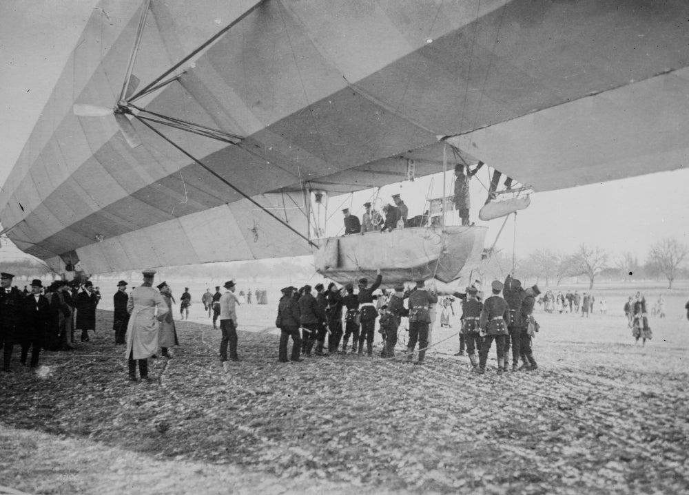 Blimp Zeppelin No. 3 Poster Print featuring spectators on the ground.