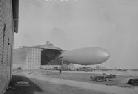 Navy Dirigible Poster Print showcasing a vintage dirigible on a navy background.