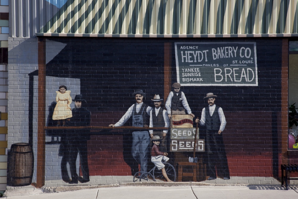Charming bakery scene poster print featuring people and a child on a tricycle.