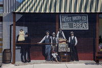Charming bakery scene poster print featuring people and a child on a tricycle.