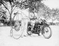 Policeman on a motorcycle giving a ticket to a man on a penny-farthing bicycle in Washington, DC