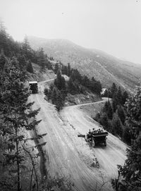 Mountain Road with Automobiles Poster Print showcasing a scenic landscape