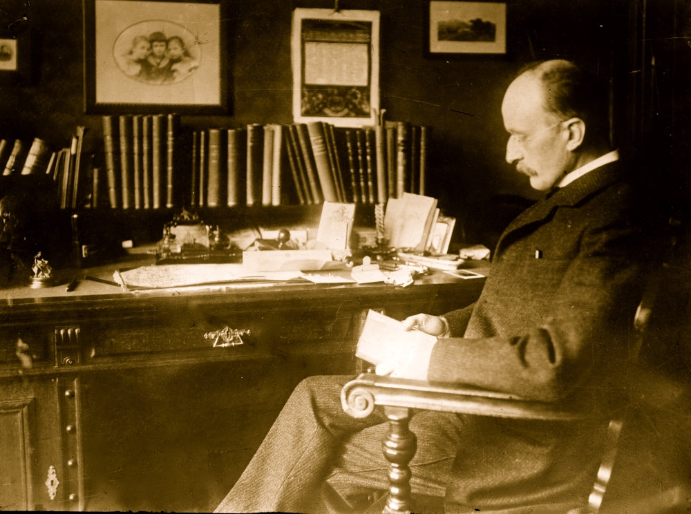 Max Planck seated at desk poster print artwork.